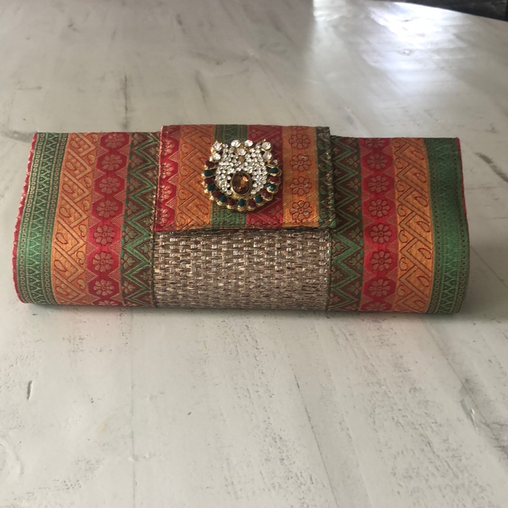 Jewel tone clutch with optional strap